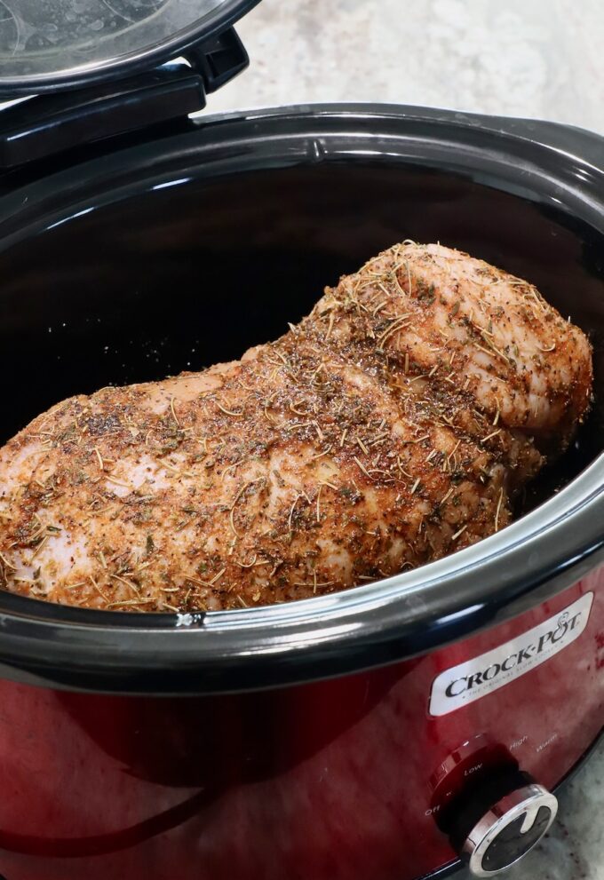 seasoned turkey breast in a crock pot