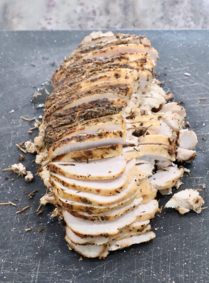 sliced turkey breast on a cutting board