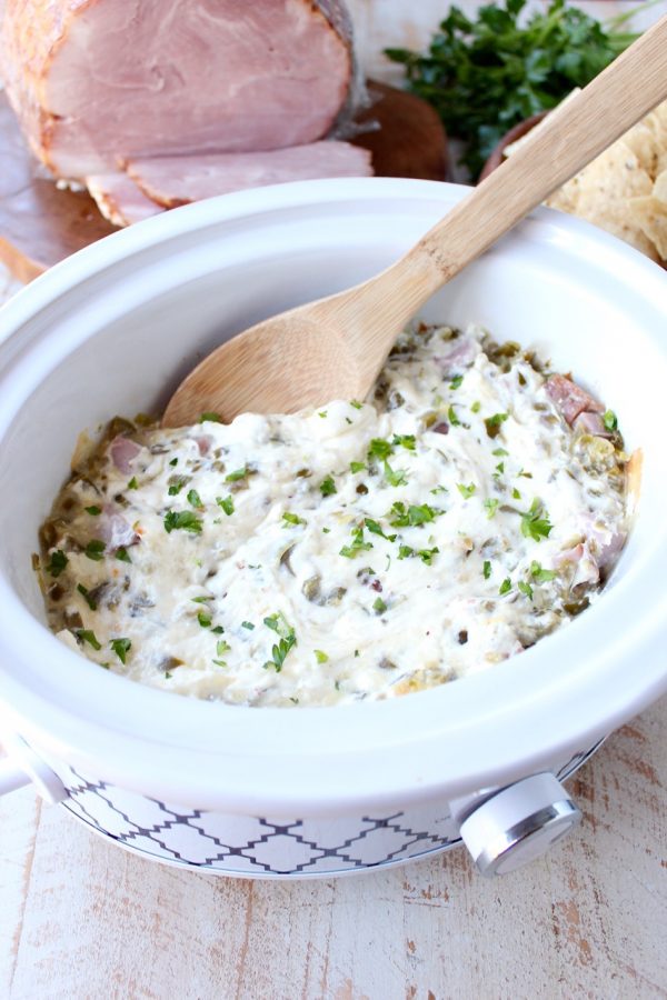 The ultimate game day party dip, this Ham and Cheese Jalapeno Popper Dip is so easy to make in the slow cooker and will be a hit with all of your friends!