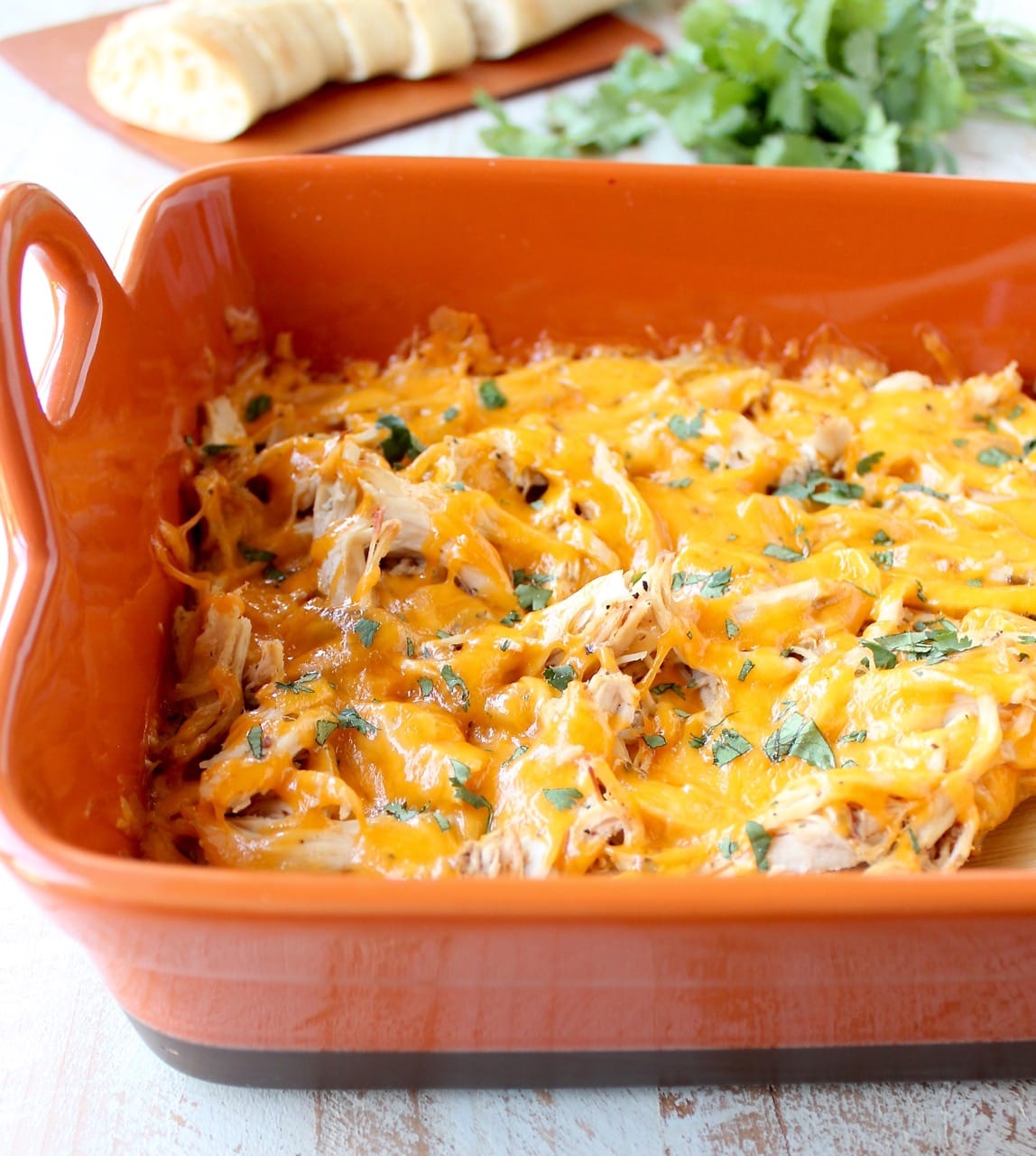 Shredded cajun turkey is placed on a layer of cajun ranch cream cheese and topped with cheddar cheese in this ultimate Cajun Turkey Cheese Dip recipe!