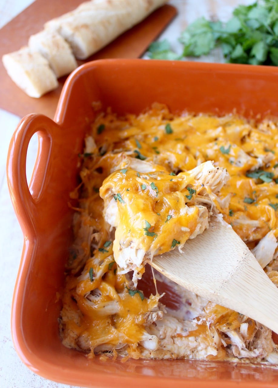 Shredded cajun turkey is placed on a layer of cajun ranch cream cheese and topped with cheddar cheese in this ultimate Cajun Turkey Cheese Dip recipe!