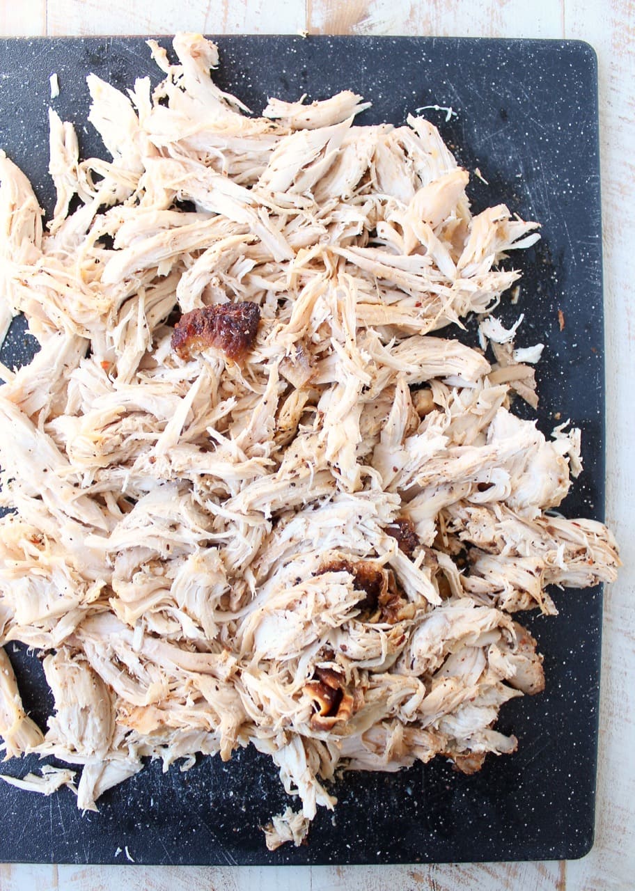 Shredded cajun turkey is placed on a layer of cajun ranch cream cheese and topped with cheddar cheese in this ultimate Cajun Turkey Cheese Dip recipe!