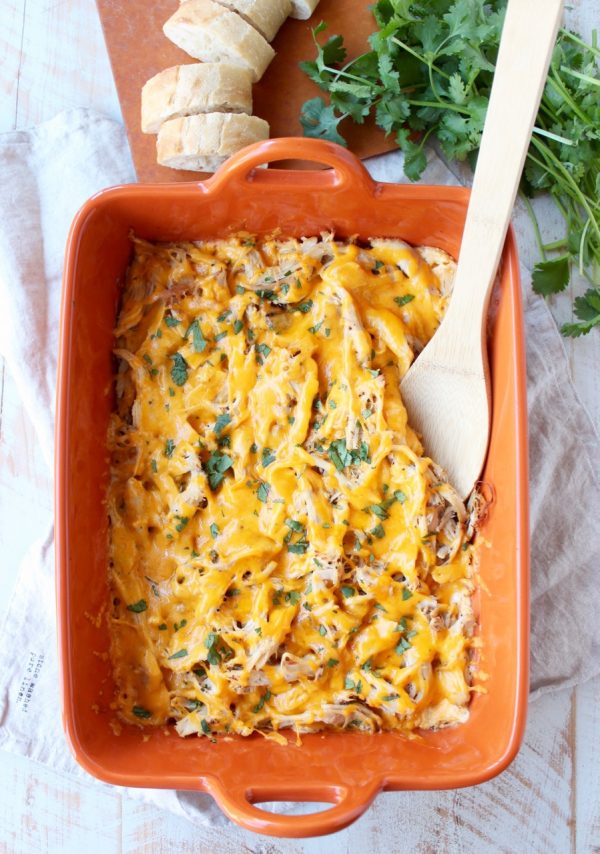 Shredded cajun turkey is placed on a layer of cajun ranch cream cheese and topped with cheddar cheese in this ultimate Cajun Turkey Cheese Dip recipe!