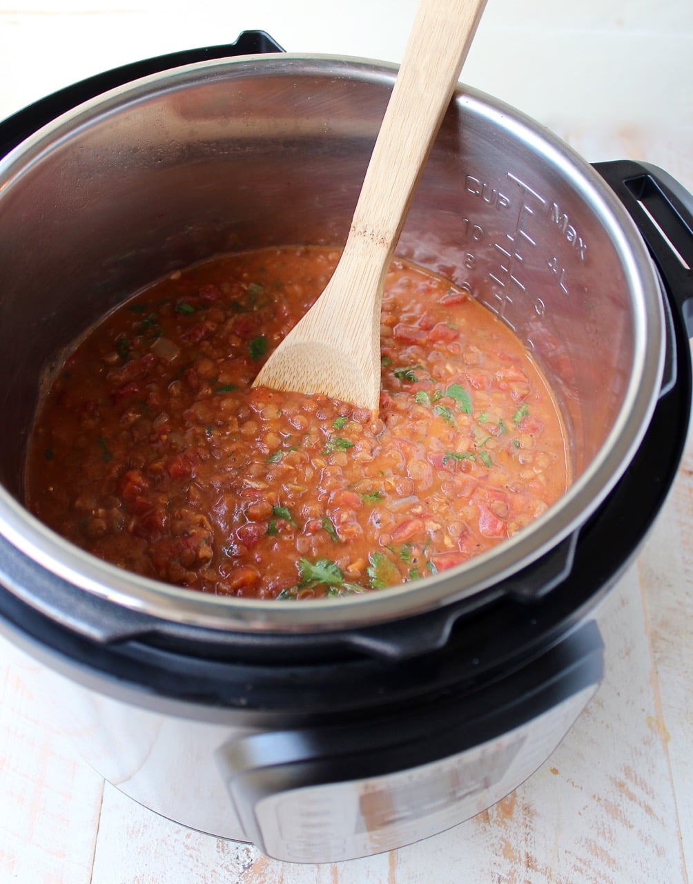 Chicken tikka masala and lentils are cooked together in an Instant Pot for an easy, gluten free weeknight meal made in under an hour!