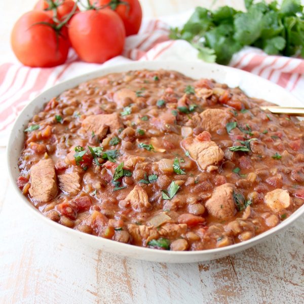 Chicken tikka masala and lentils are cooked together in an Instant Pot for an easy, gluten free weeknight meal made in under an hour!