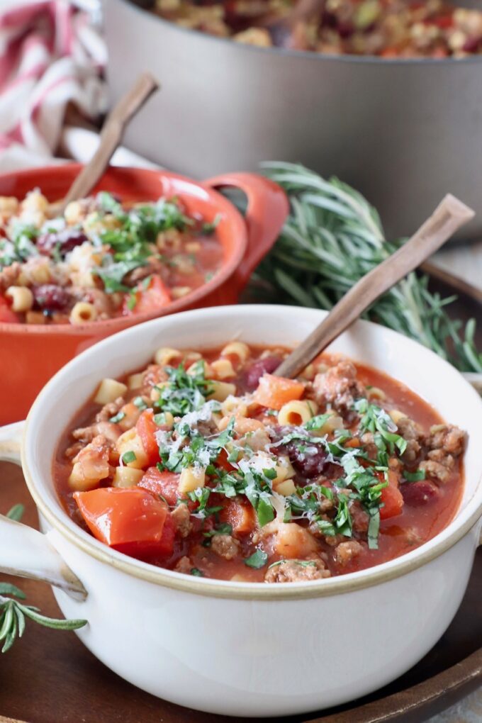 pasta fagioli soup in two bowls with spoons