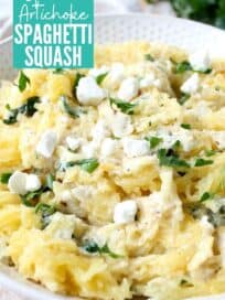 roasted spaghetti squash in bowl with spinach artichoke sauce