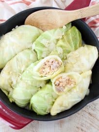 These German inspired Cabbage Rolls are filled with ground pork and sauerkraut, then simmered in a garlic onion broth for an amazingly flavorful recipe!