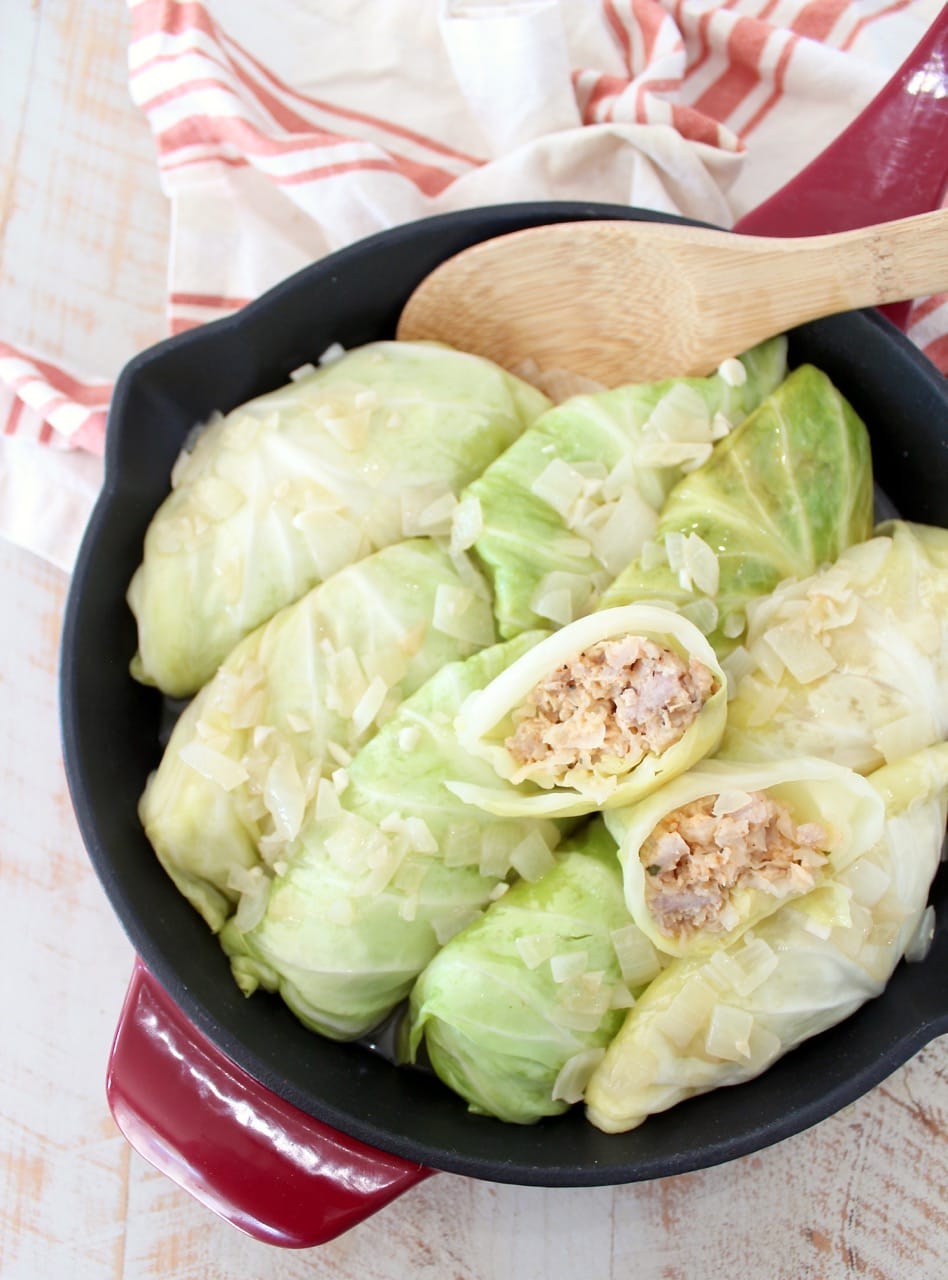 These German inspired Cabbage Rolls are filled with ground pork and sauerkraut, then simmered in a garlic onion broth for an amazingly flavorful recipe!