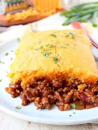 Traditional cornbread chili pie is kicked up a notch in this downright delicious version made with buffalo sauce and cheddar cheese!