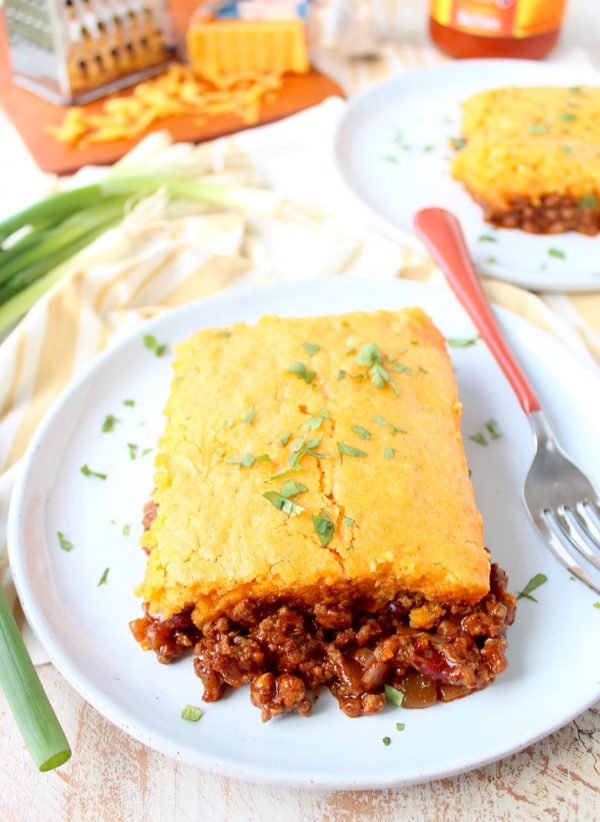 Traditional cornbread chili pie is kicked up a notch in this downright delicious version made with buffalo sauce and cheddar cheese!