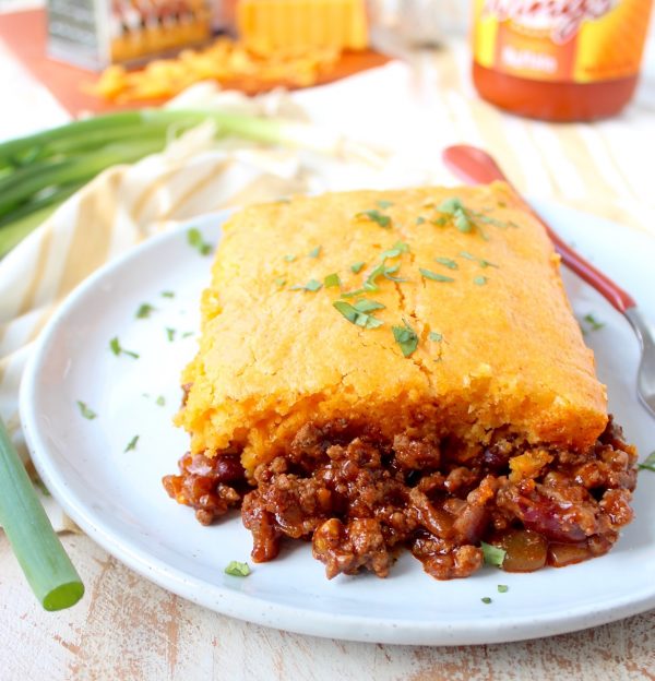 Traditional cornbread chili pie is kicked up a notch in this downright delicious version made with buffalo sauce and cheddar cheese!