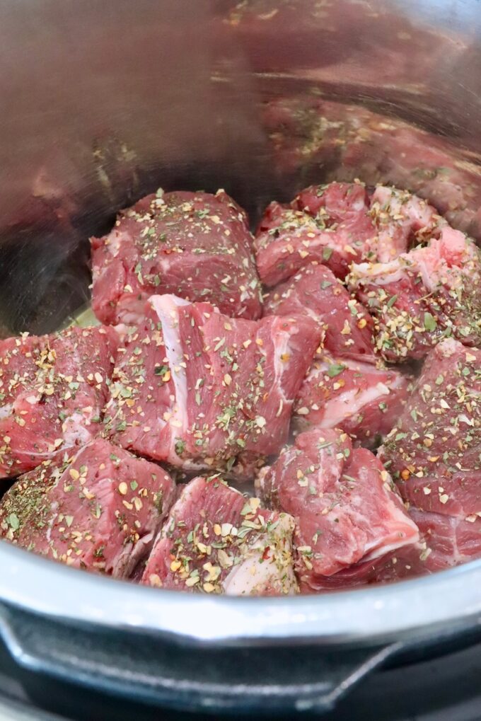 seasoned chunks of beef chuck roast in an Instant Pot