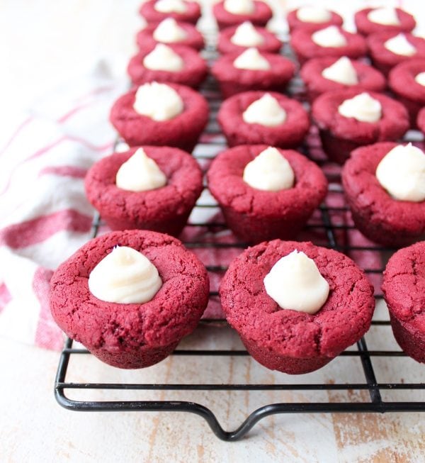 Red velvet cookie cups filled with cream cheese frosting are a delicious and adorable dessert recipe that's also easy to make! Perfect for Valentine's Day, birthdays or any day you're craving a sweet treat!