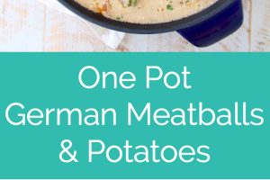 german meatballs and potatoes in creamy sauce in blue cast iron skillet