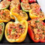 Ground chicken, spices, veggies and buffalo sauce are baked in bell peppers for a healthy recipe that's gluten free, dairy free and Whole30 compliant!