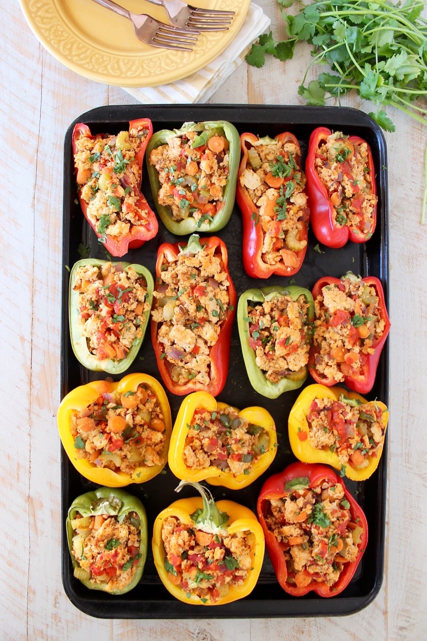 Buffalo chicken stuffed bell peppers on baking sheet