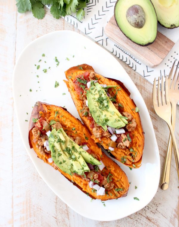 Deliciously easy Whole30 chipotle chili is added to these stuffed sweet potatoes for a scrumptious gluten free and dairy free meal, made in under an hour!