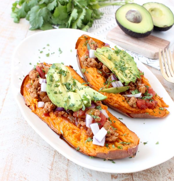 Deliciously easy Whole30 chipotle chili is added to these stuffed sweet potatoes for a scrumptious gluten free and dairy free meal, made in under an hour!