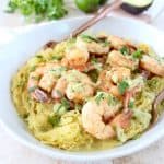 This delicious Whole30 recipe combines roasted spaghetti squash and green chili avocado sauce with cilantro lime shrimp for a healthy, gluten free and dairy free meal!