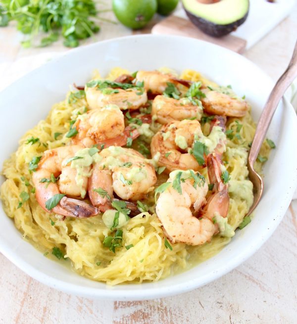 This delicious Whole30 recipe combines roasted spaghetti squash and green chili avocado sauce with cilantro lime shrimp for a healthy, gluten free and dairy free meal!