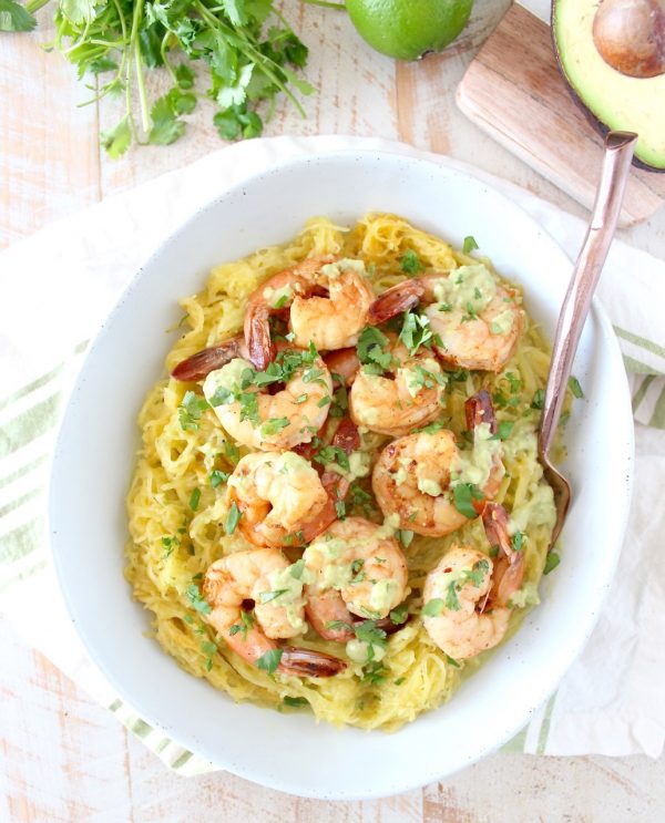 This delicious Whole30 recipe combines roasted spaghetti squash and green chili avocado sauce with cilantro lime shrimp for a healthy, gluten free and dairy free meal!