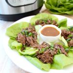 Whole30 Thai Beef is easy to make in the Instant Pot in under an hour. Shred the beef and serve it in lettuce wraps for a Whole30 meal or serve it in corn tortillas for a gluten free Thai twist on Taco Tuesday!