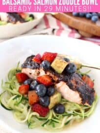 Balsamic glazed salmon in bowl with zucchini noodles and berry avocado salsa