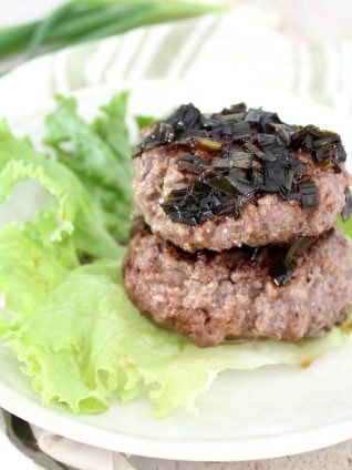 Whole30 Hamburgers are healthy, packed with protein, and gluten free, they're wrapped in lettuce and topped with a sesame scallion sauce for a flavorful meal!