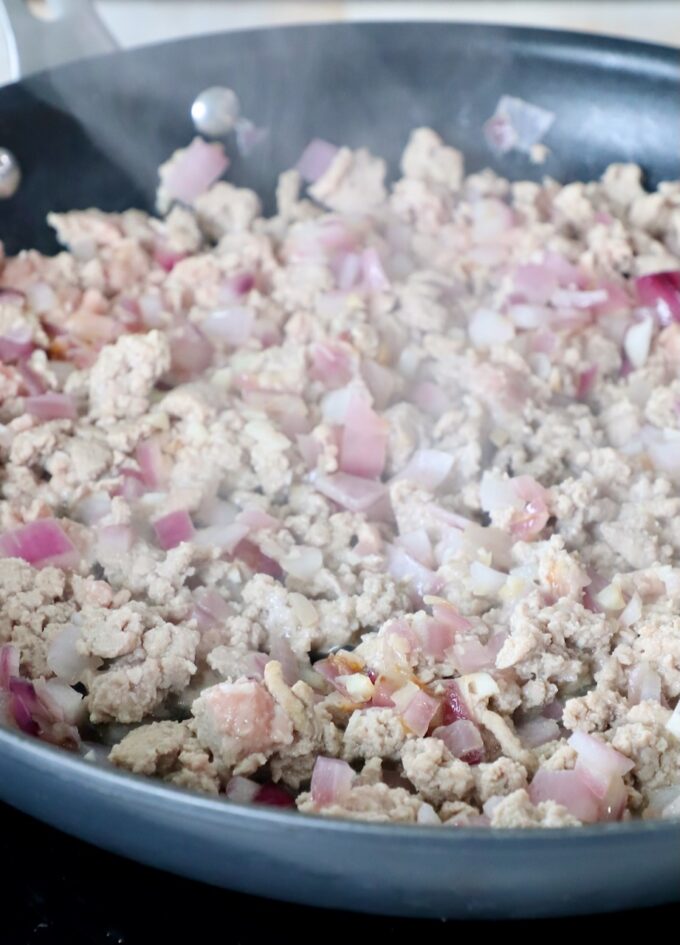 cooked ground turkey in skillet with onions and garlic