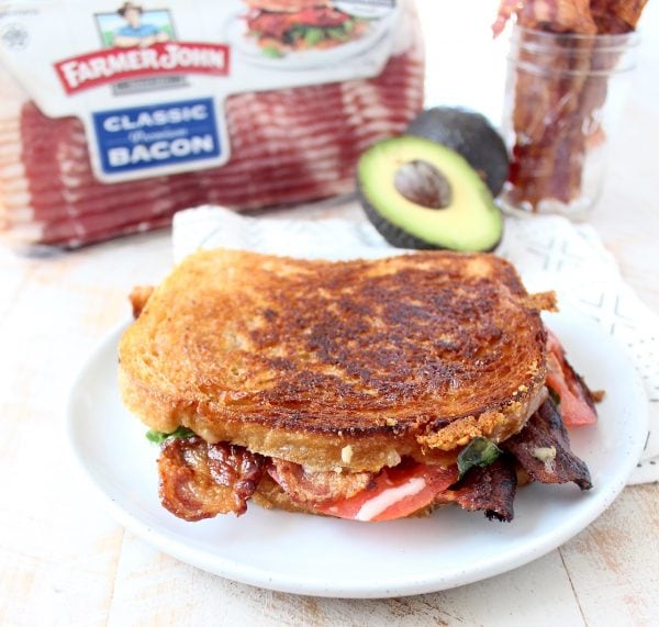 Crispy bacon, creamy avocado and juicy tomatoes are combined in this scrumptious gruyere and avocado grilled cheese sandwich recipe!