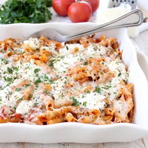 Three cheese baked ziti with ricotta, mozzarella and parmesan is an easy 6 ingredient, 29 minute meal that is sure to become a weeknight dinner family favorite!