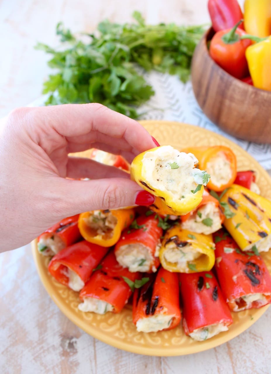 Hand Holding Grilled Stuffed Peppers