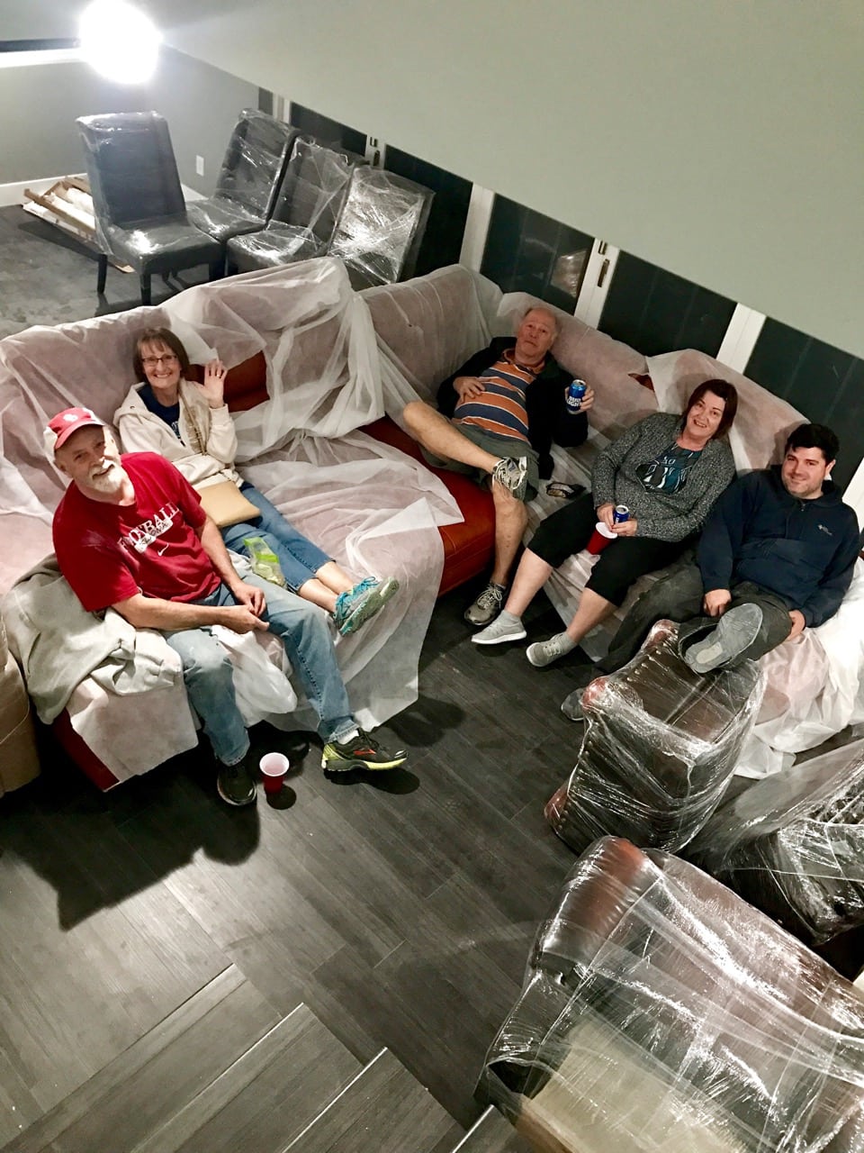 Family on couch after moving