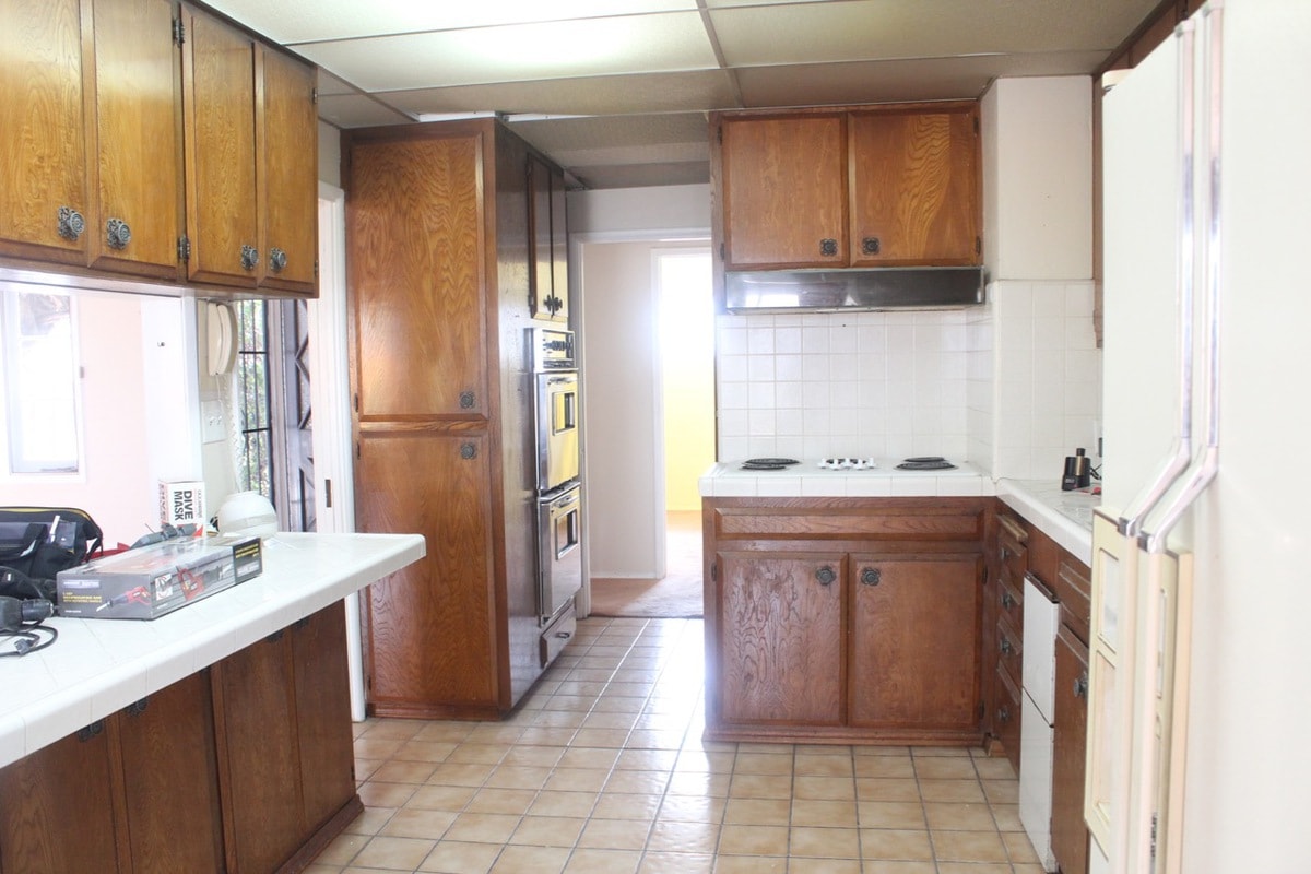 Old kitchen layout with brown cabinets