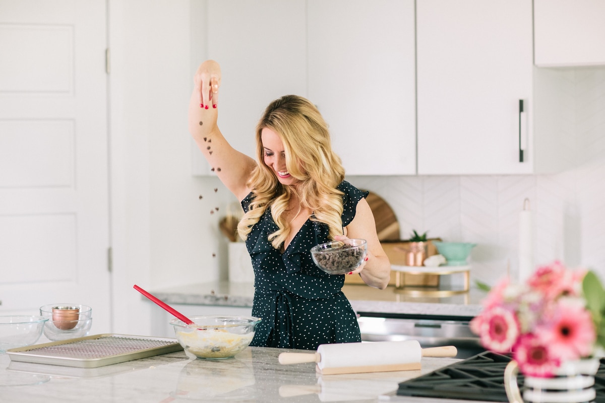 Whitney Bond making chocolate chip cookies in kitchen