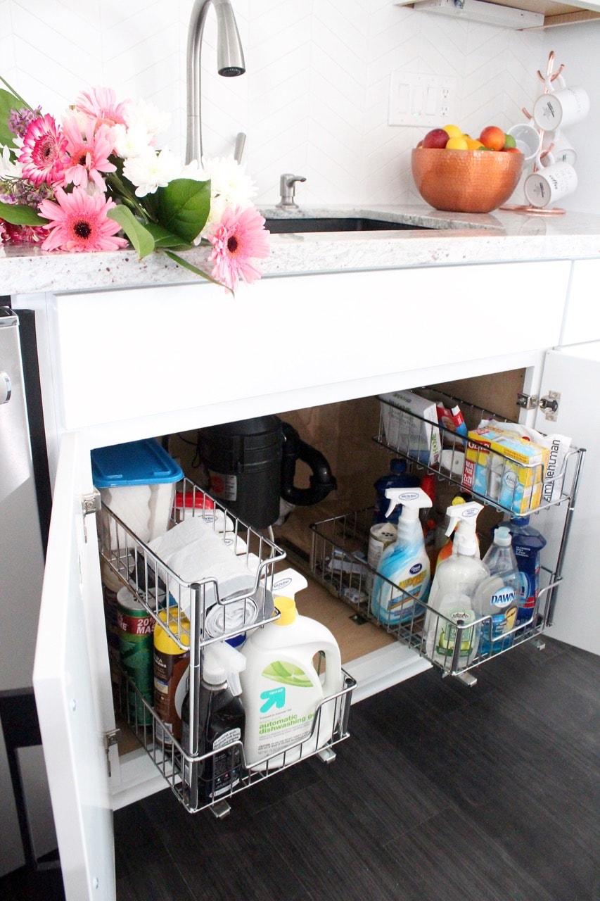Under sink pull out wire racks for cleaning supplies