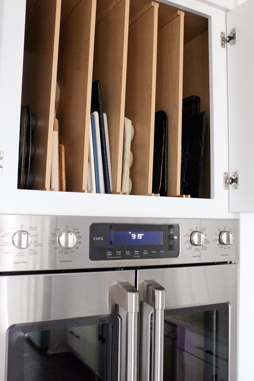 Above oven cutting board and baking sheet organizer