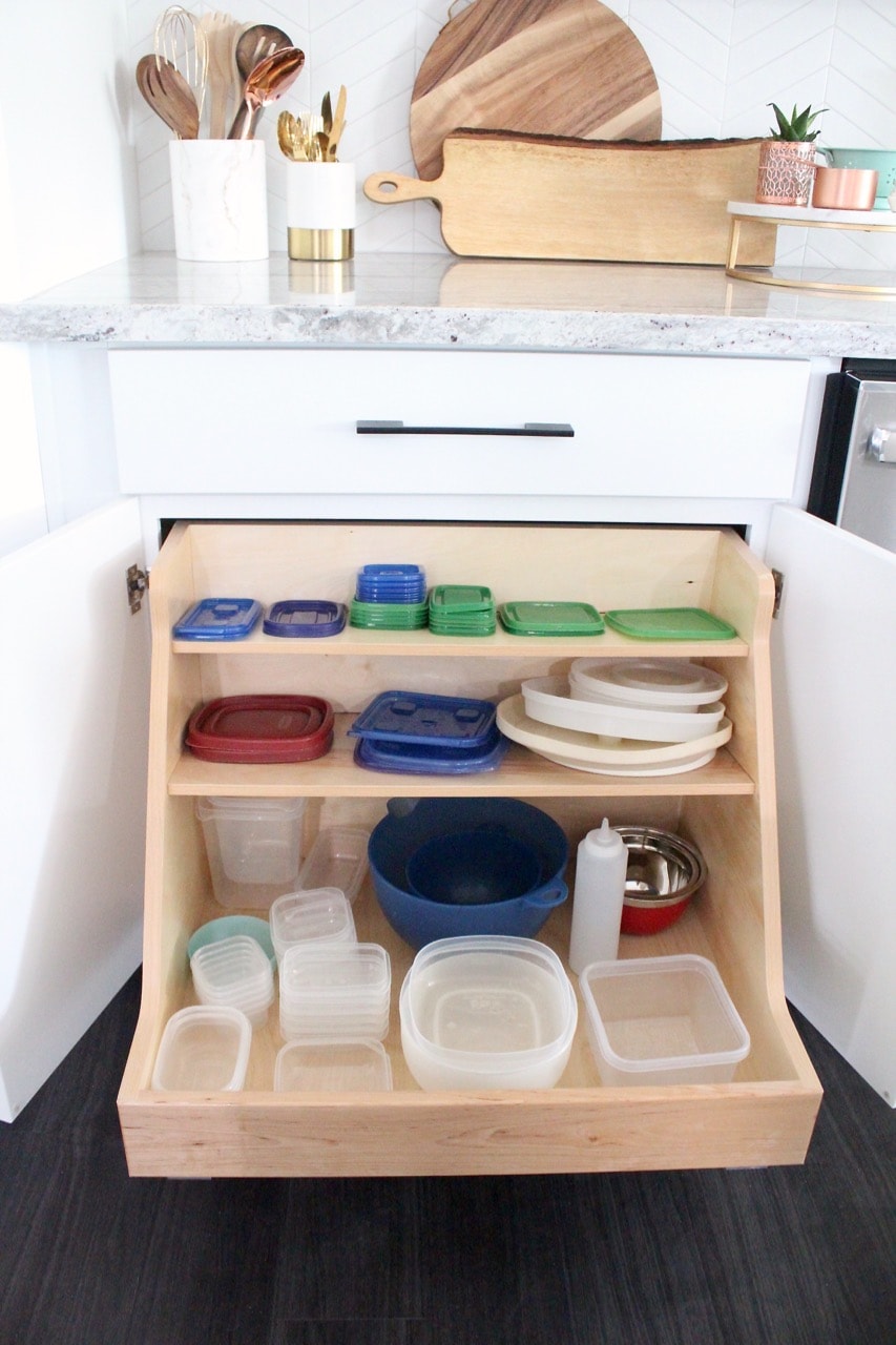 Cabinet with pull out shelves for organizing storage containers