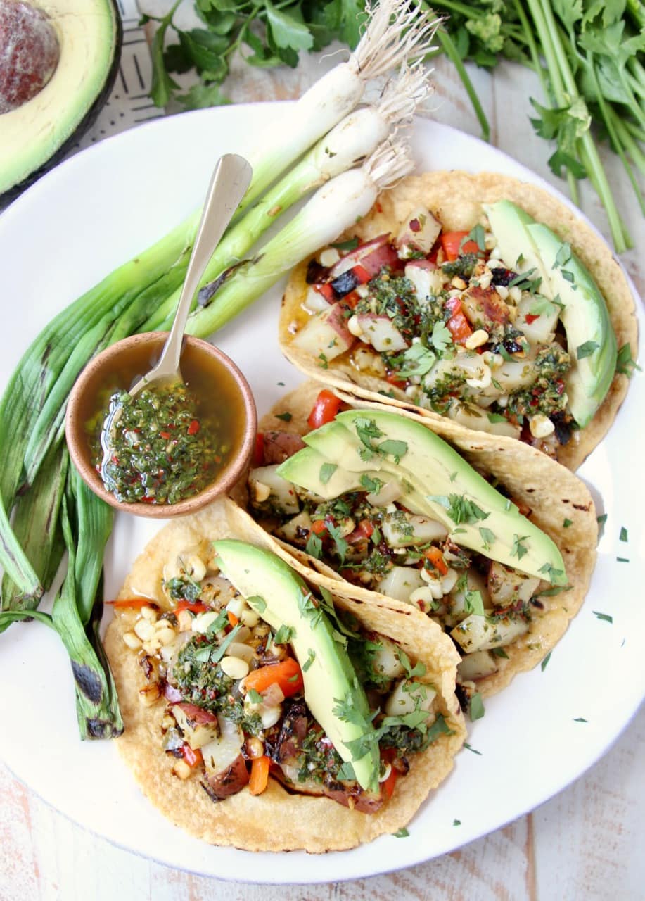 Vegan Tacos filled with Grilled Vegetables, Chimichurri Sauce and Fresh Avocado Slices