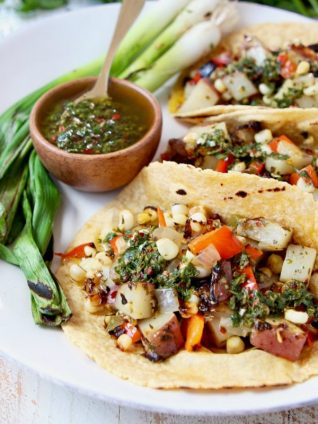 Vegan Tacos filled with Grilled Potatoes, Peppers Corn and Chimichurri Sauce