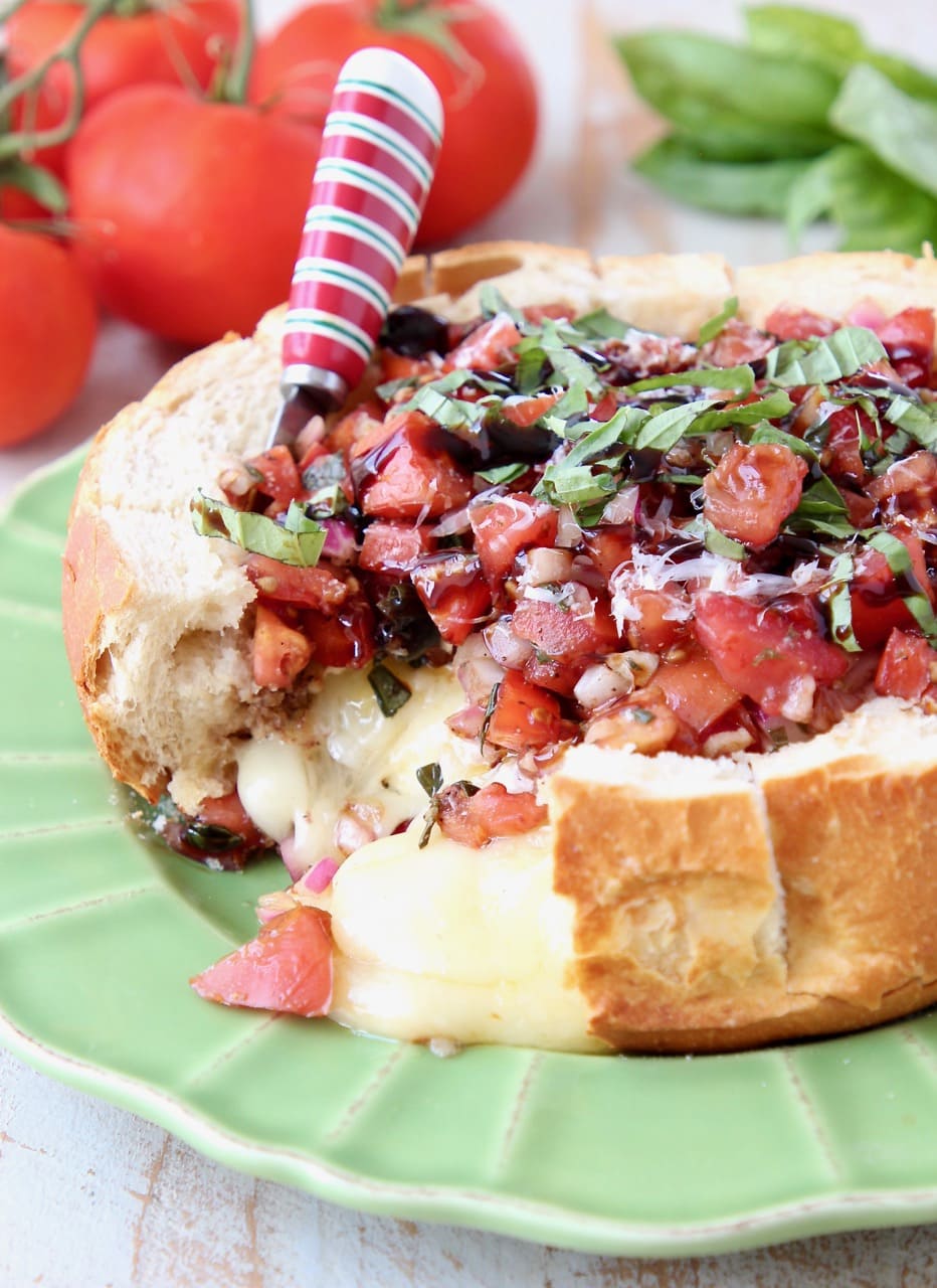Baked Brie in a Sourdough Bread Bowl topped with Tomato Basil Bruschetta
