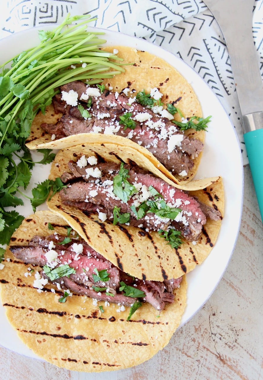 Cajun Steak Tacos in Grilled Corn Tortillas with Fresh Cilantro and Cotija Cheese