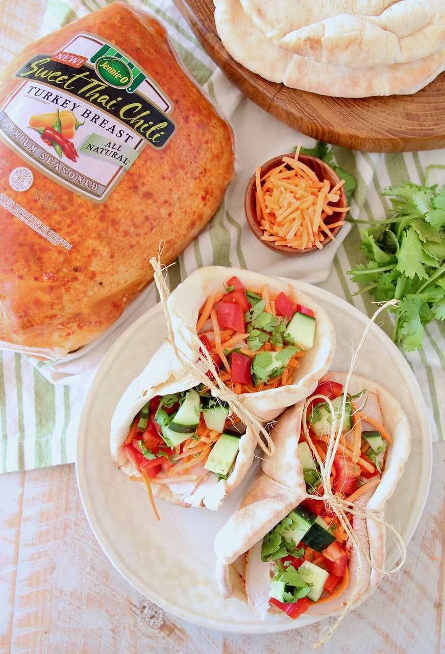 Turkey Pita Wrap on plate with cucumber, carrots, cilantro and Jennie O Sweet Thai Chili Turkey Breast