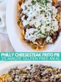 philly cheesesteak frito pie in casserole dish topped with creamy provolone sauce