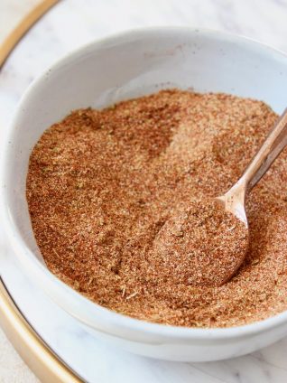 Homemade taco seasoning mixed in bowl with spoon