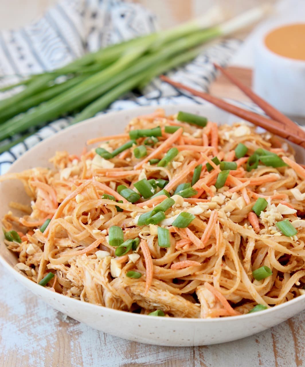 Pressure cooker Thai Peanut Chicken Noodles with shredded carrots, peanuts and scallions