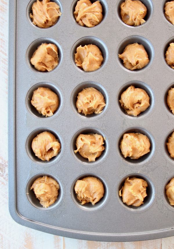 Pumpkin cookie dough in mini muffin tin