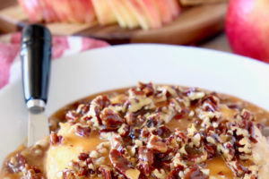 The best easy baked brie recipe with salted caramel and pecans