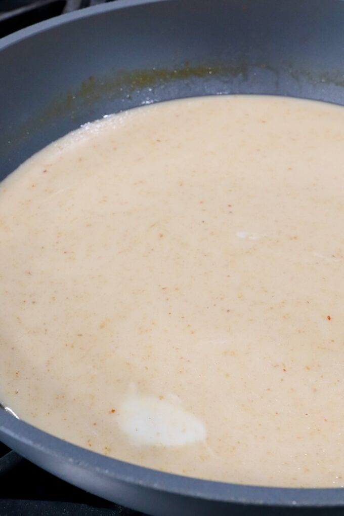 coconut milk and broth in a large pot